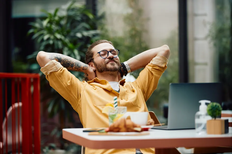 Relaxed man behind desk